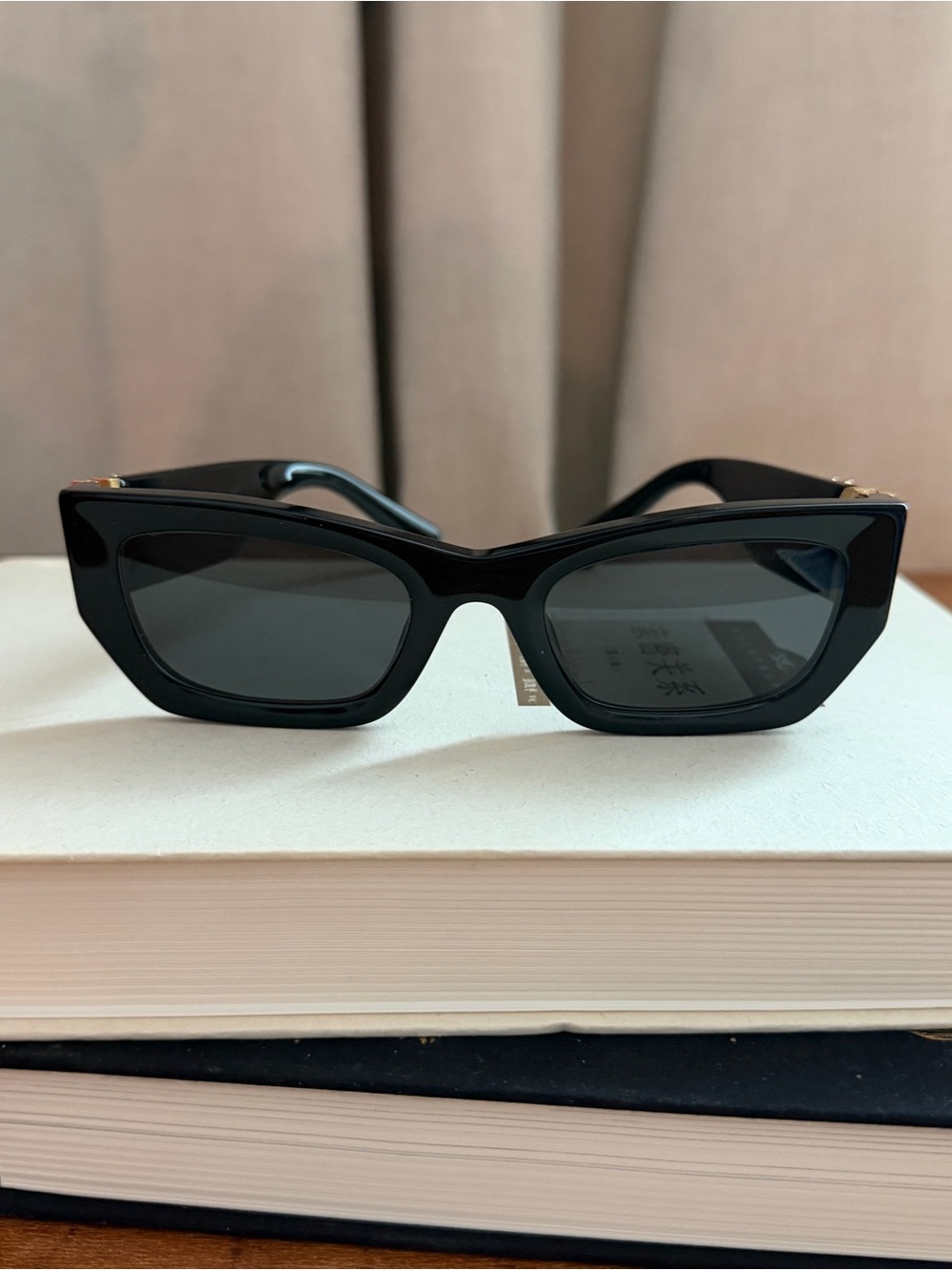 Miu Miu Black Cat-Eye Sunglasses with Gold Logo Accents - Picture 3 of 3